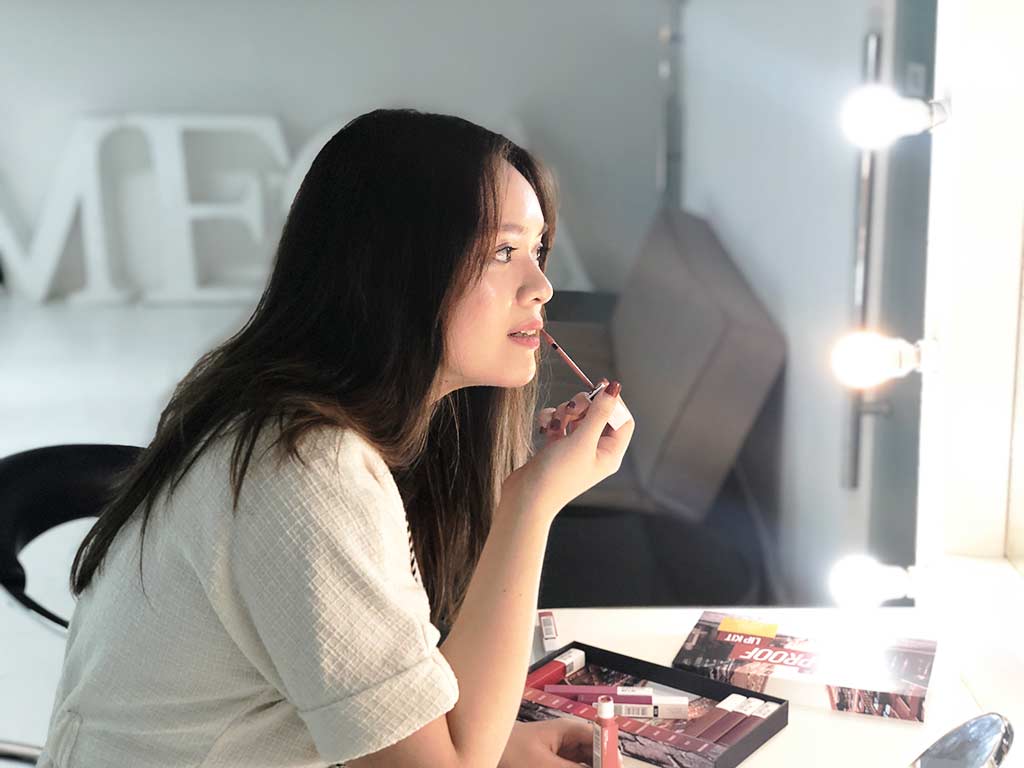 Marella putting on Maybelline Super Stay Matte Ink