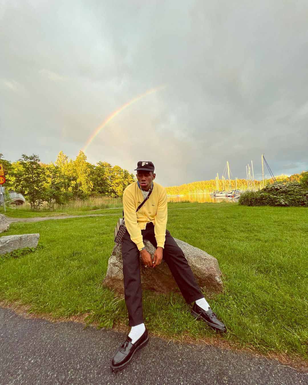 Tyler, the Creator with a pair of loafers