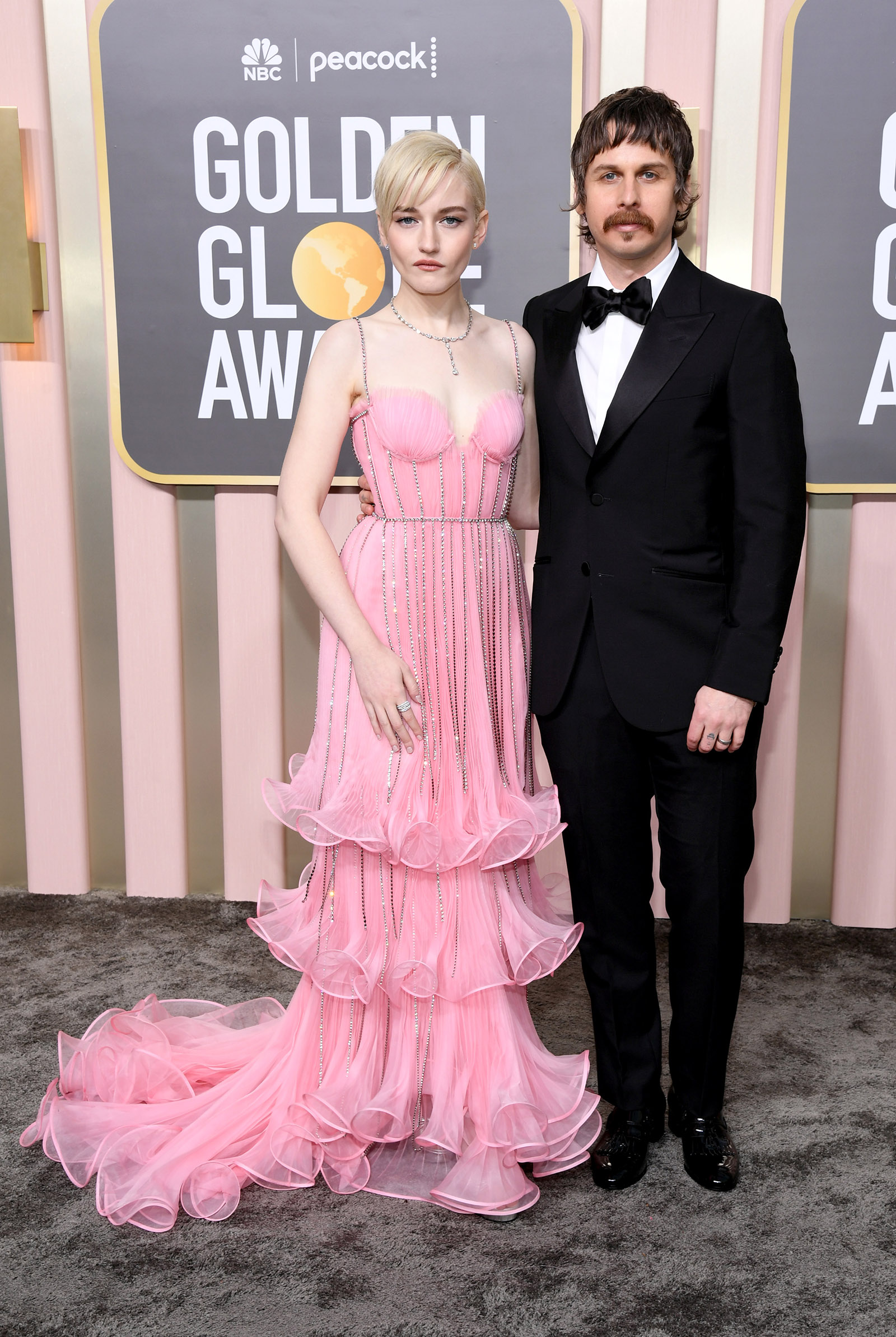 Mark Foster, Julia Garner in Gucci tuxedo