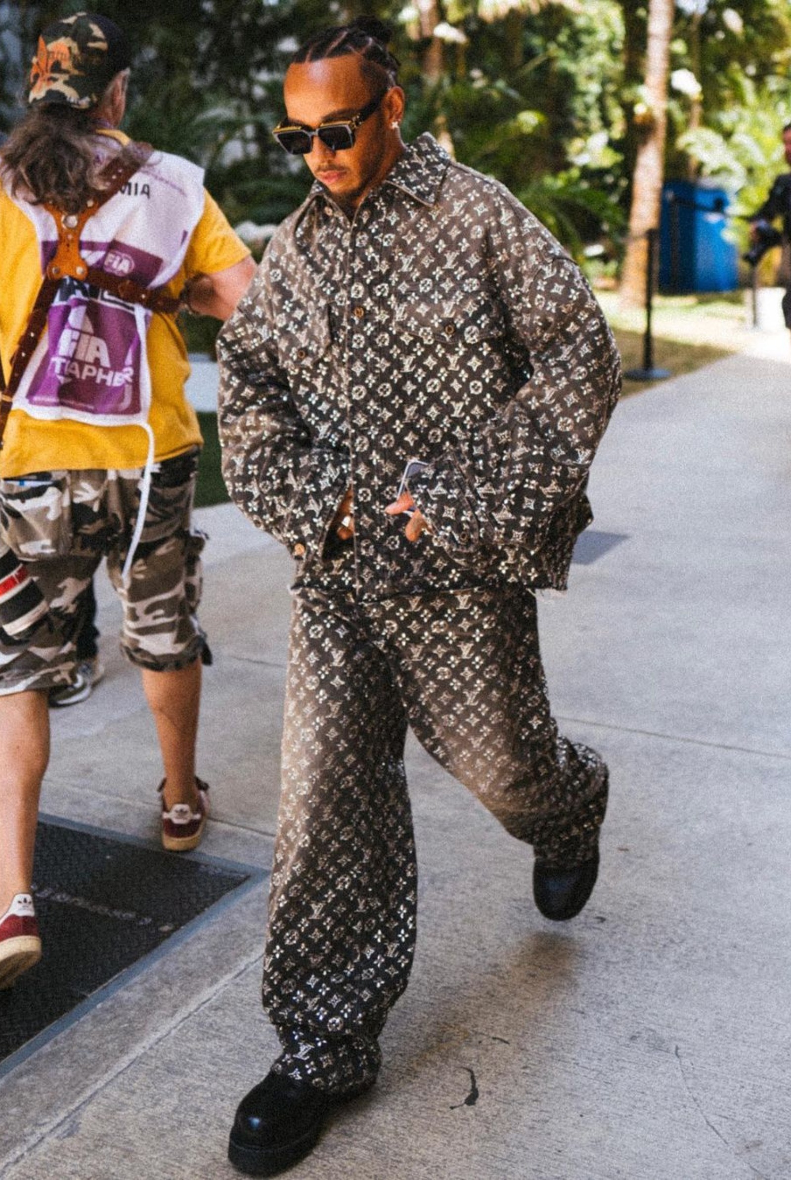 Lewis Hamilton wearing crystal-encrusted jacket and pants from Louis Vuitton's 2023 fall menswear collection
