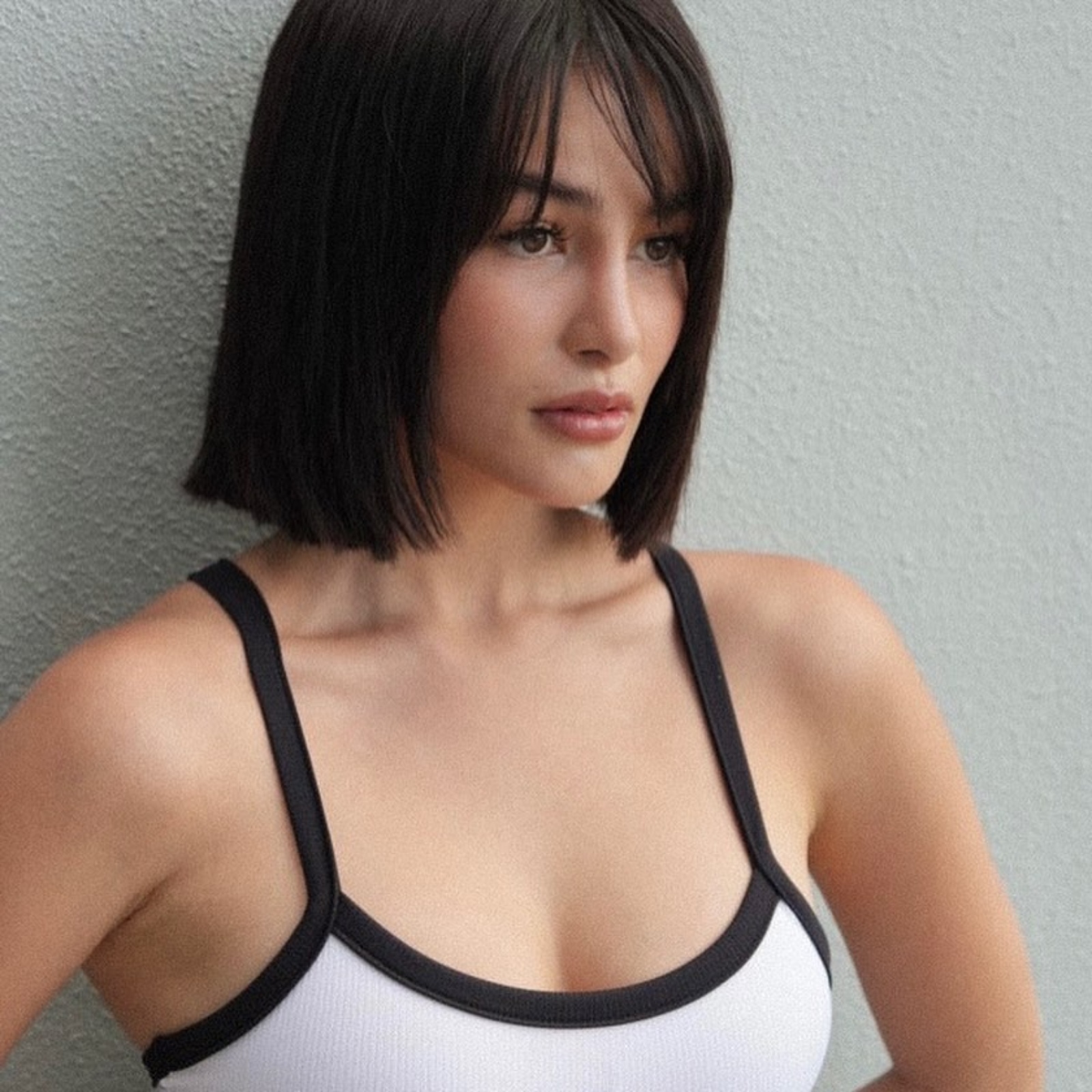 Elisse Joson in a sleek, straight, neck-length lob