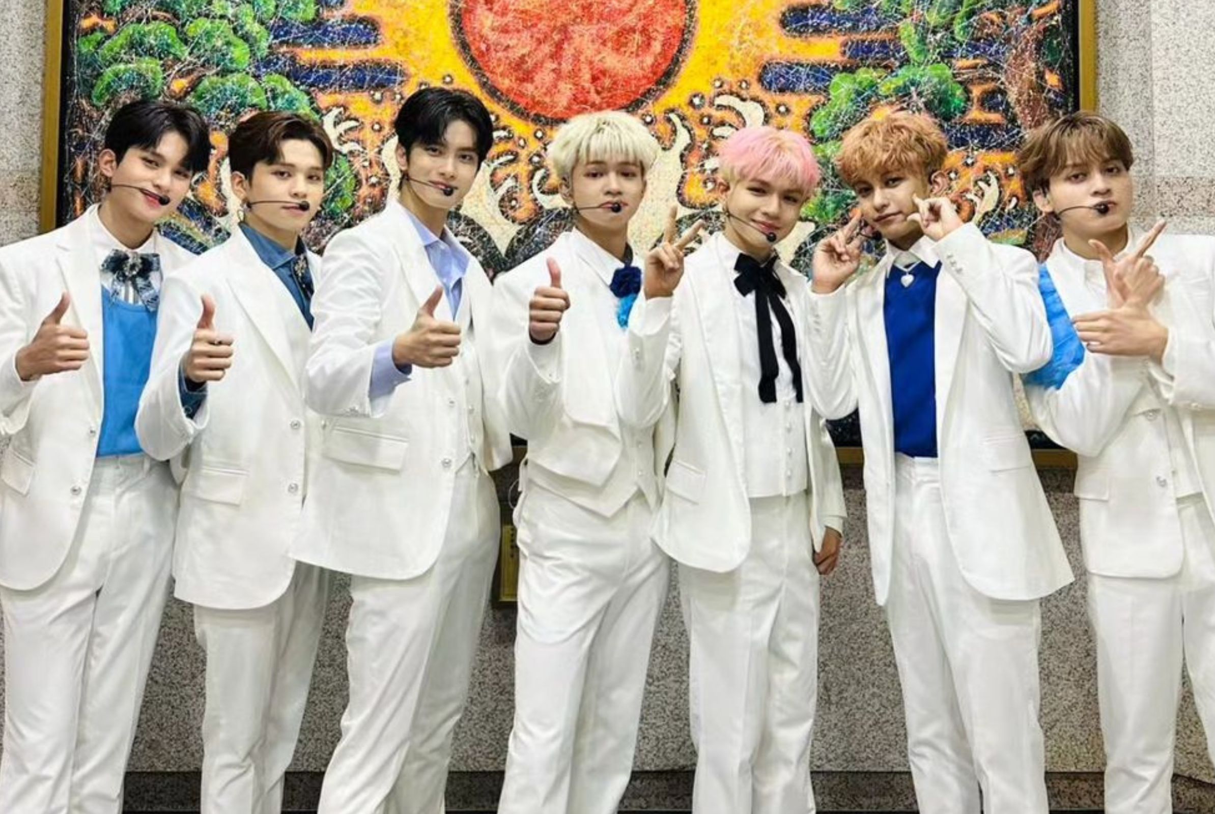 Hori7on nailing a sharp and stylish look in white suits with subtle pops of blue
