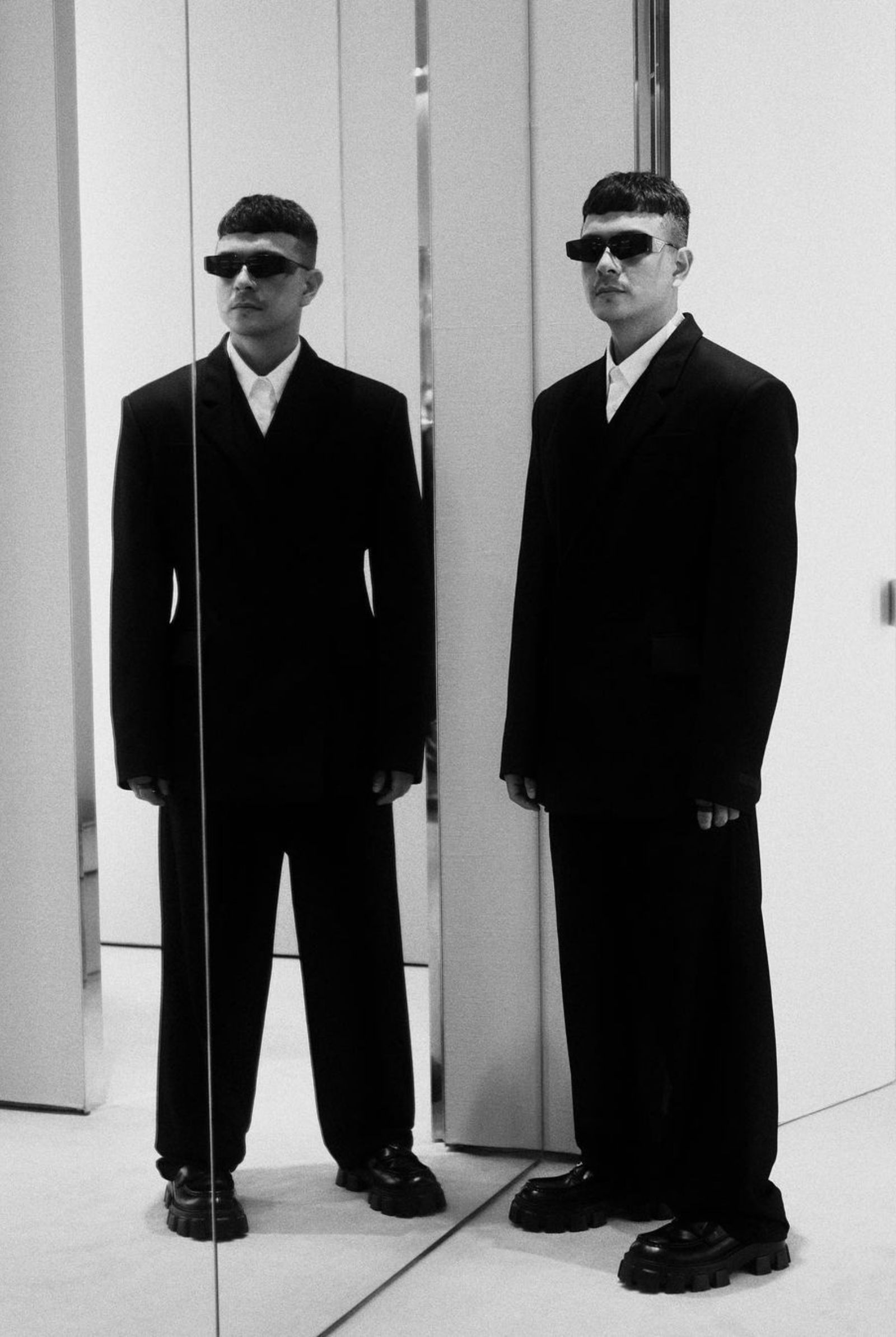 The actor looks sleek and sophisticated in his Prada suit