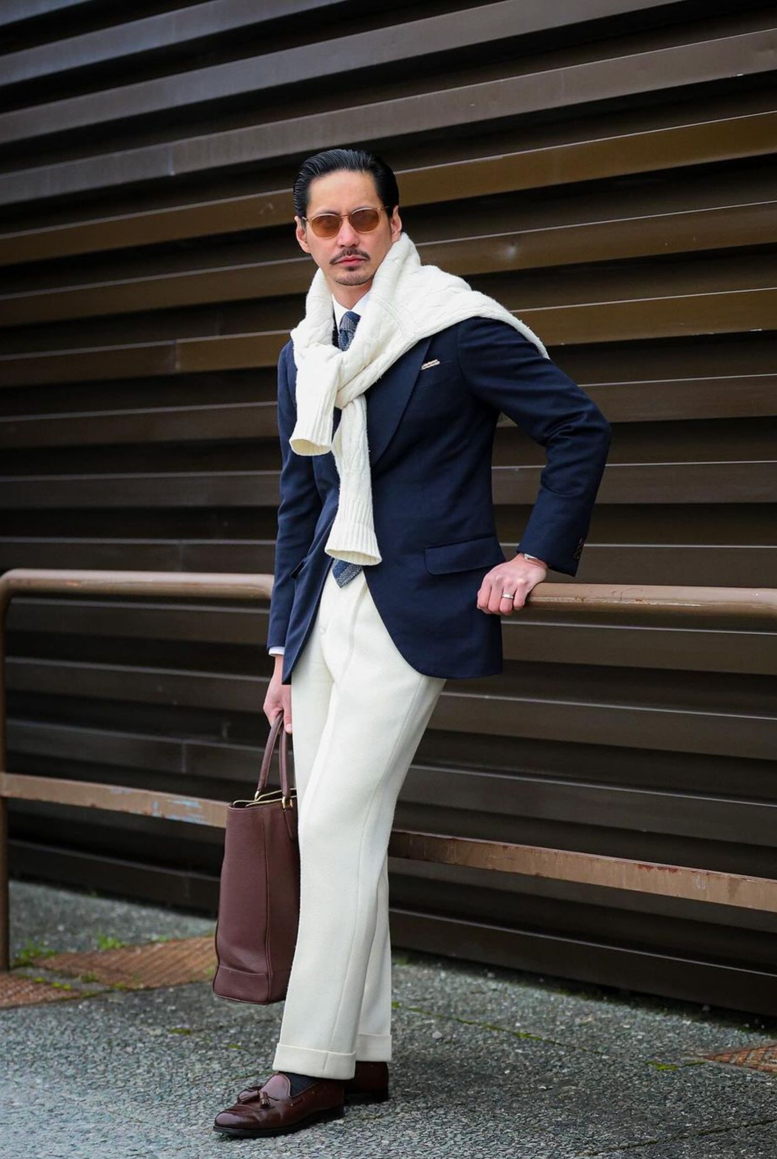 He switches to a stylish blue theme on day 2, showcasing a navy cashmere jacket, shirt, and tie