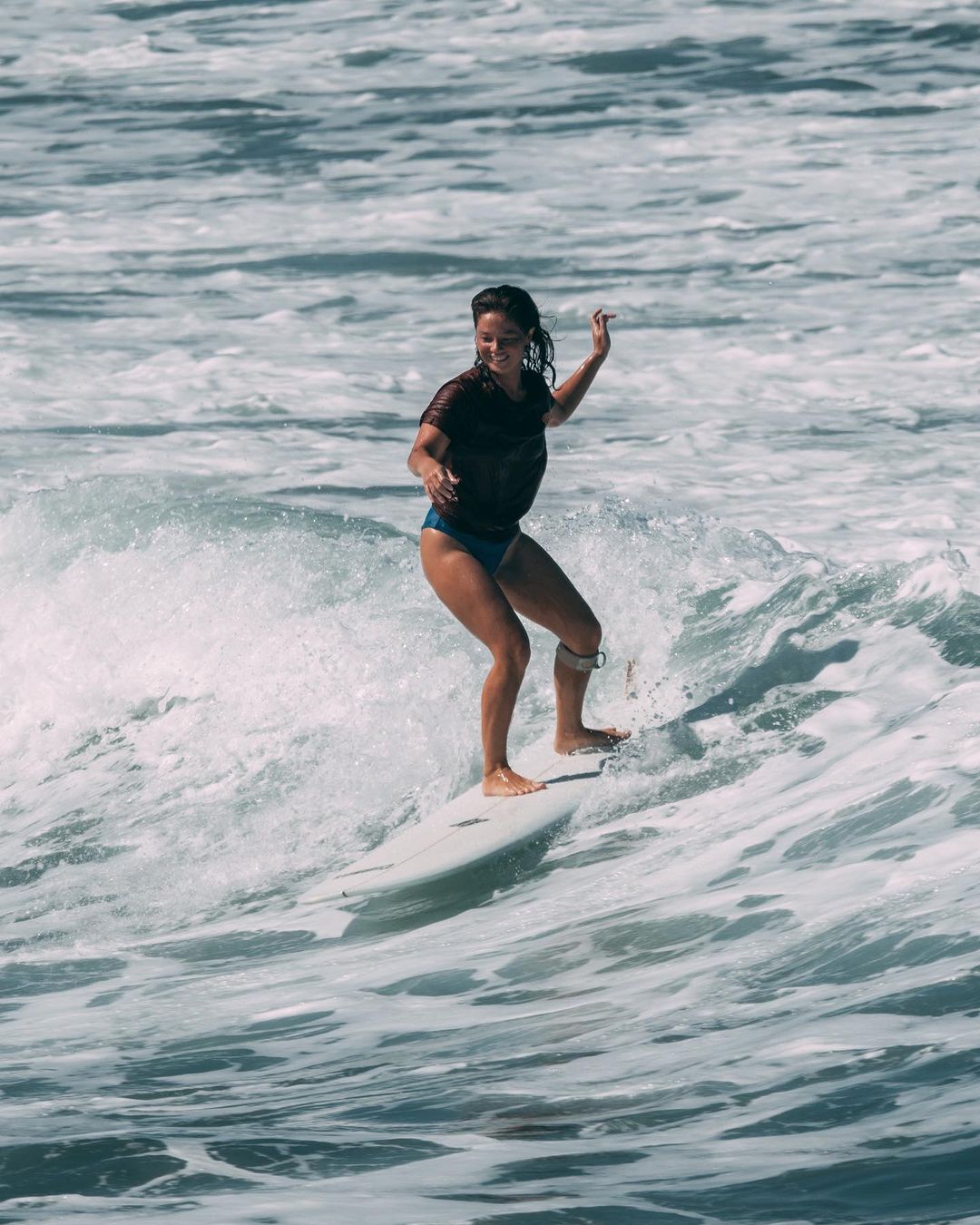 Andi Eigenmann surfing under the sun