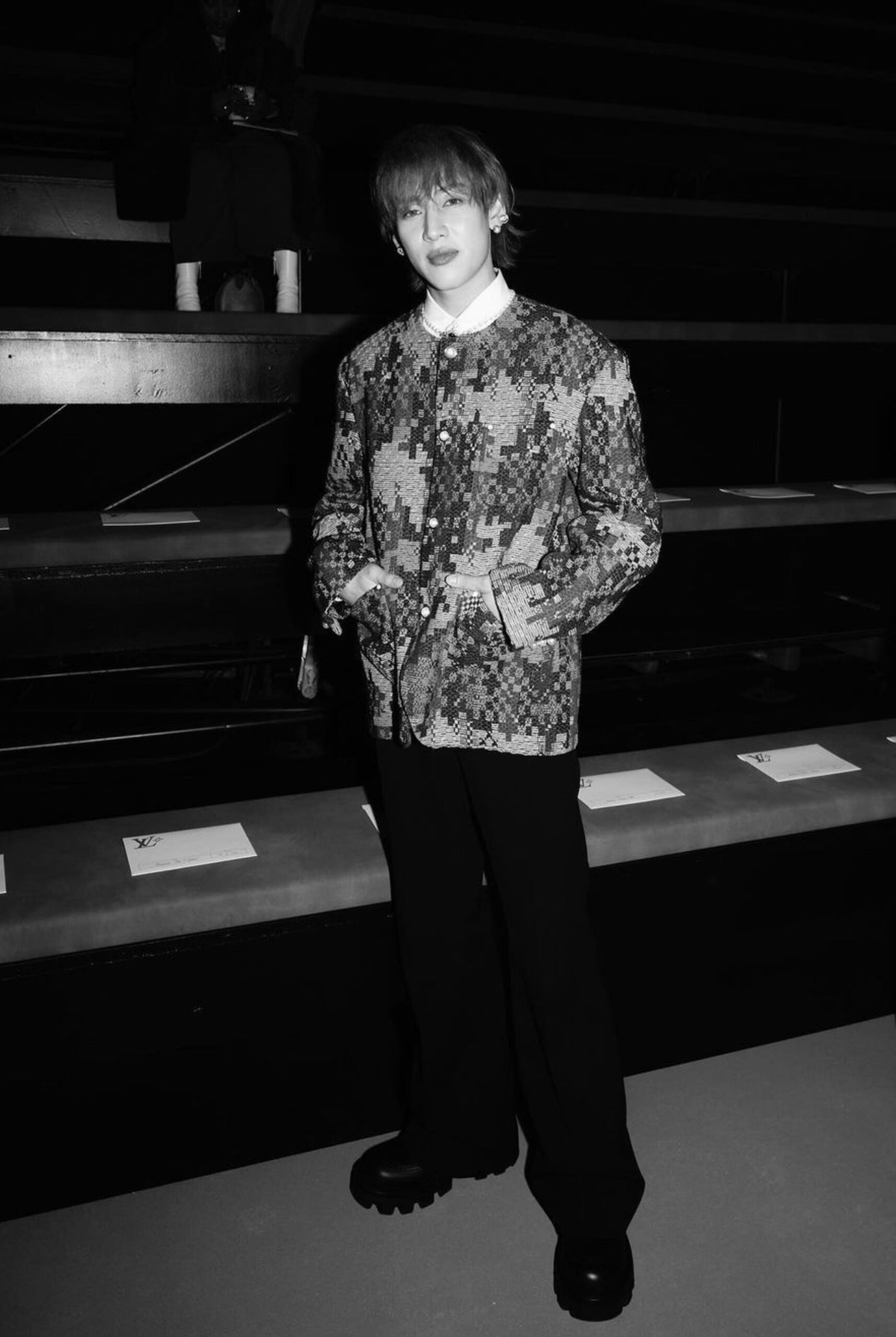 The K-Pop star dons a Louis Vuitton's Chic Collarless Cashmere Blend Damier Tweed