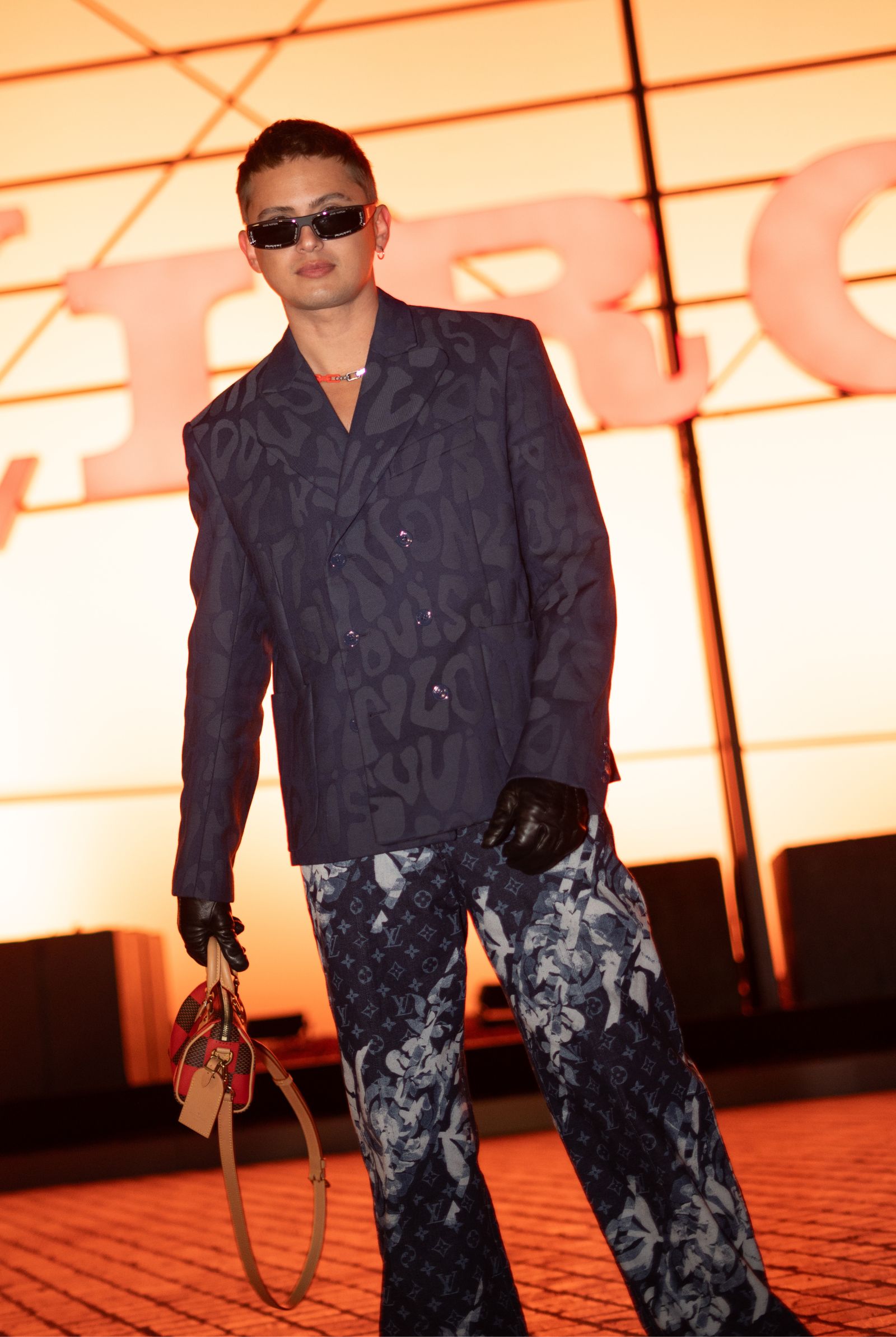 At the Louis Vuitton show, James Reid rocked a sleek ensemble blending diverse designs, colors, textures, and silhouettes while maintaining a stylish look.
