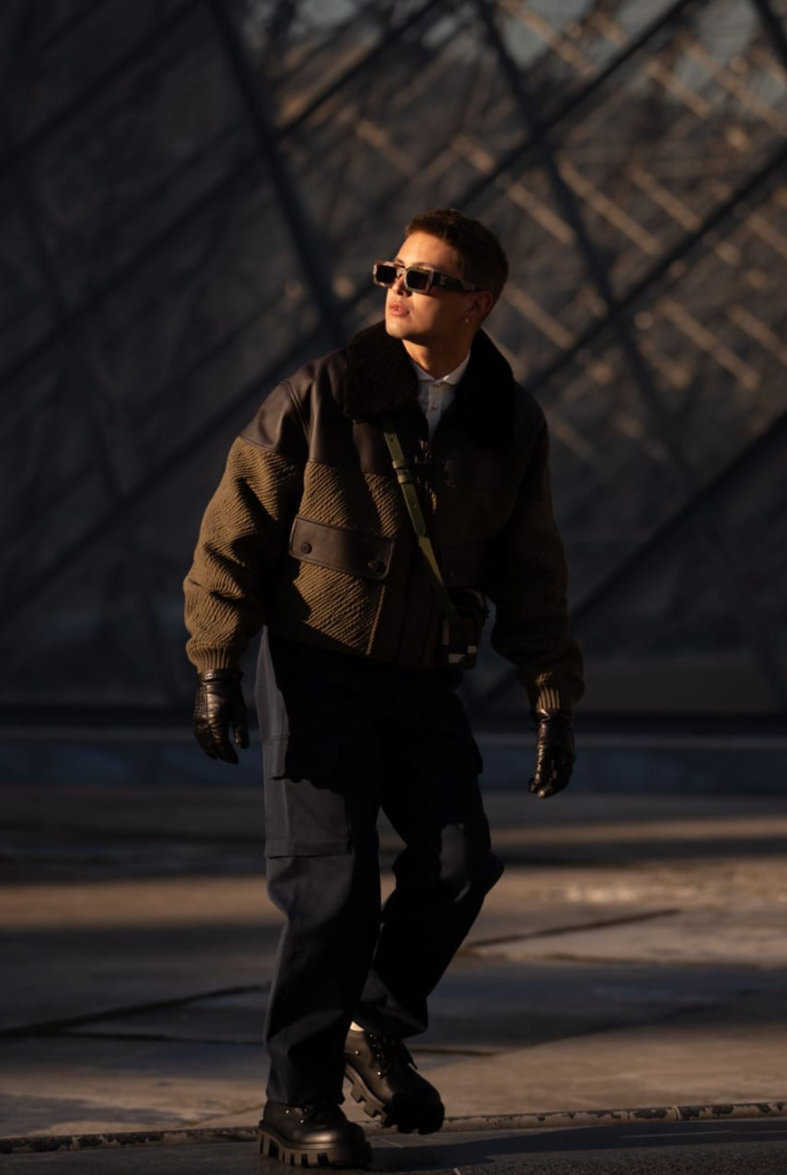 The Filipino artist exudes style with a hint of rugged sophistication outside the Louvre.