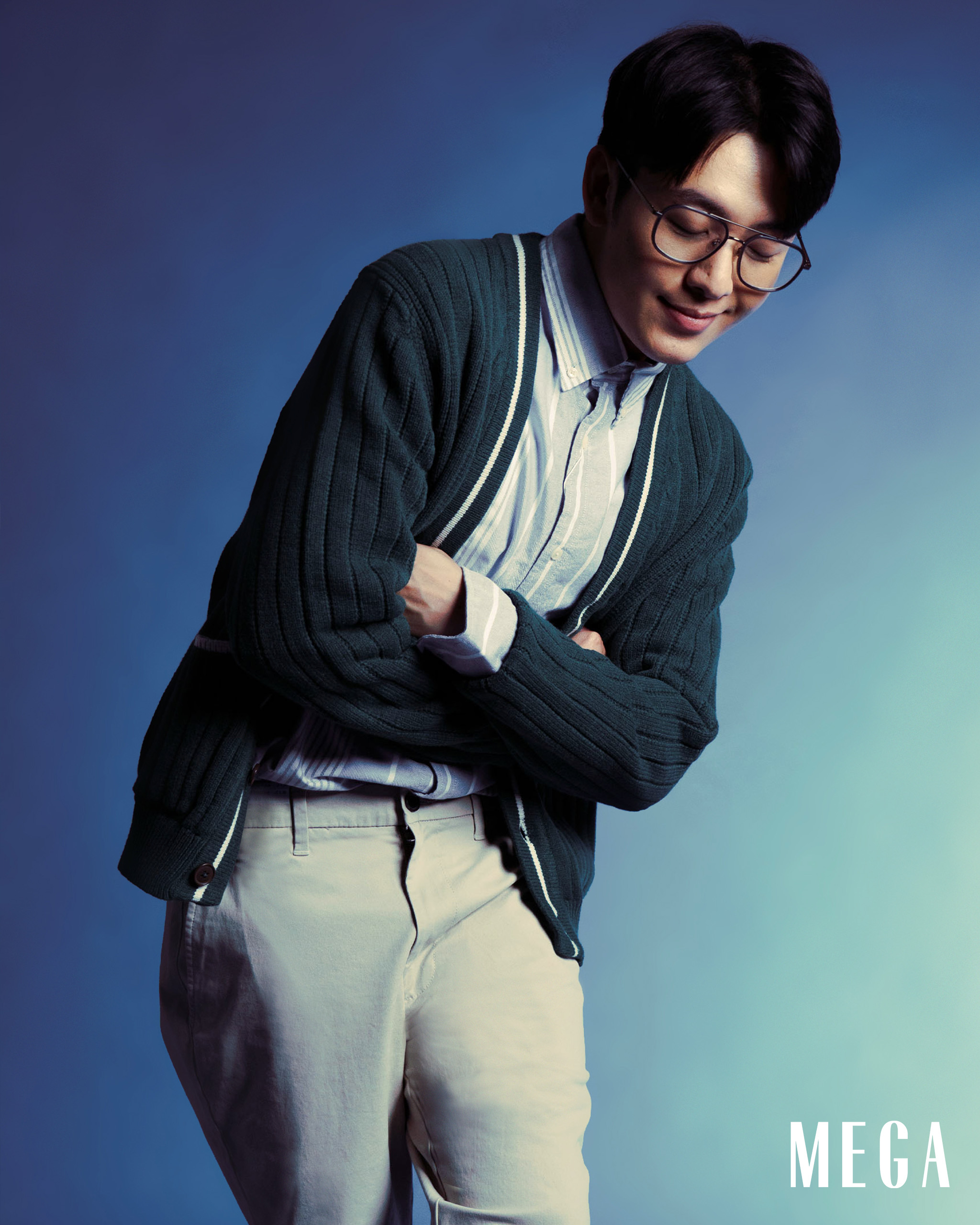 kerwin king in cardigan, oxford shirt, waist trousers marks and spencer spring collection