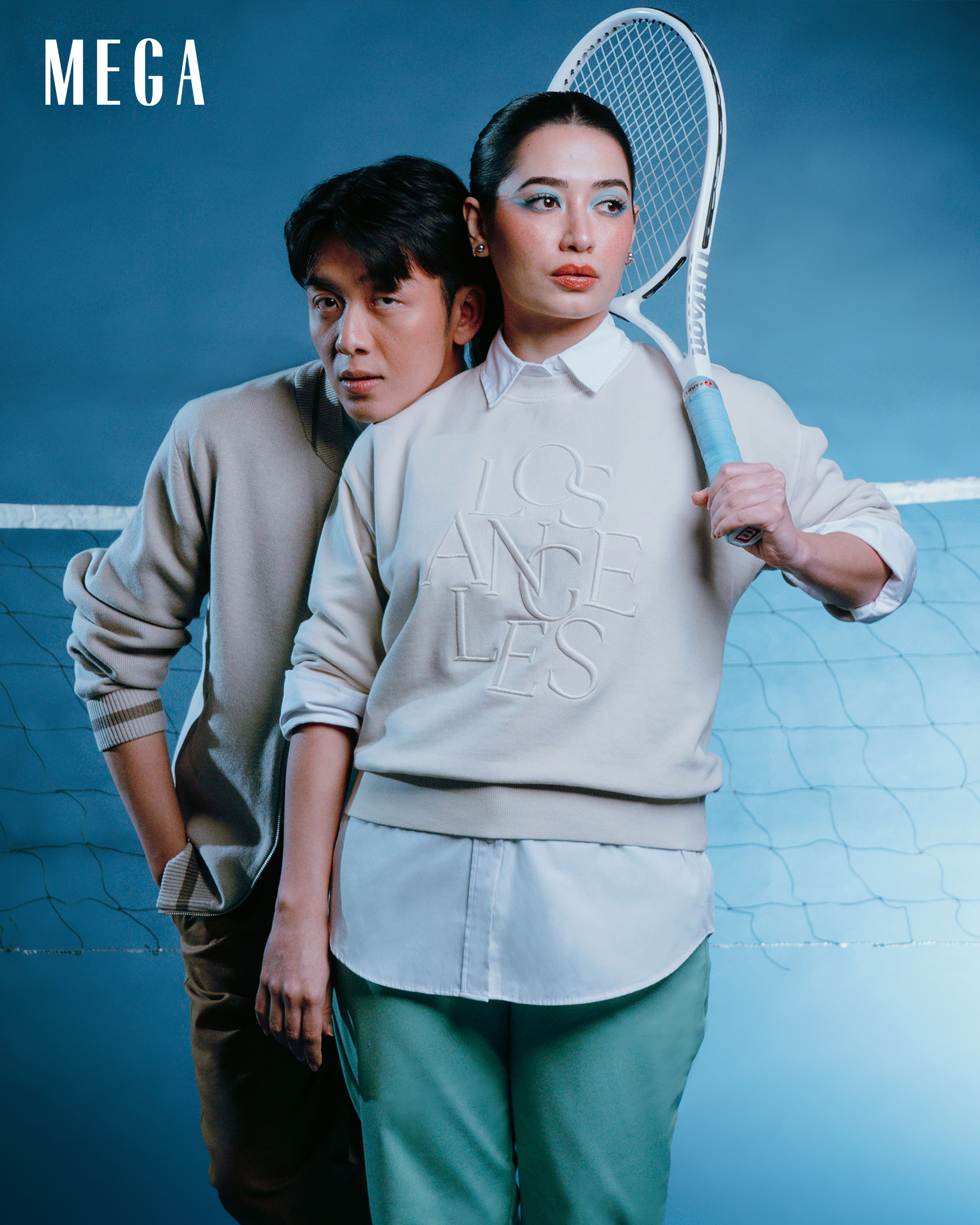 kerwin king and nicole andersson in knitted jacket, denim shirt, chinos