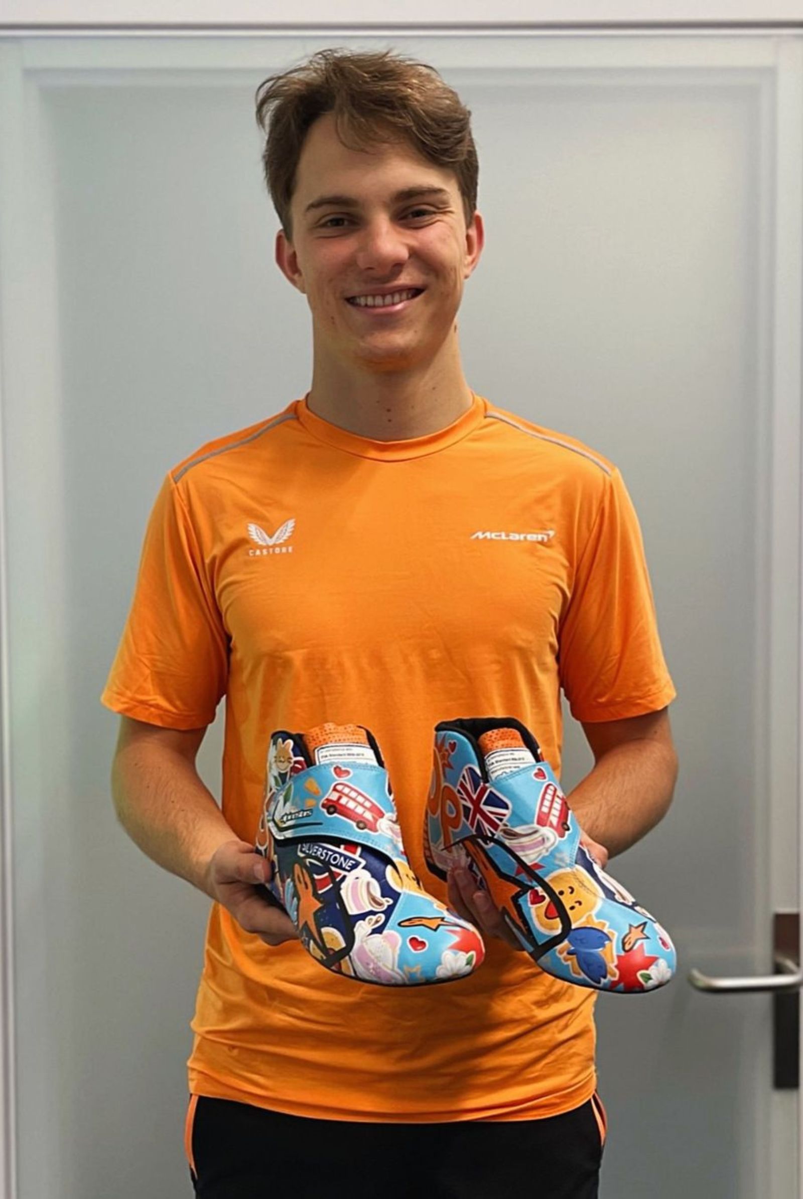 McLaren driver Oscar Piastri with Faith Rino's design