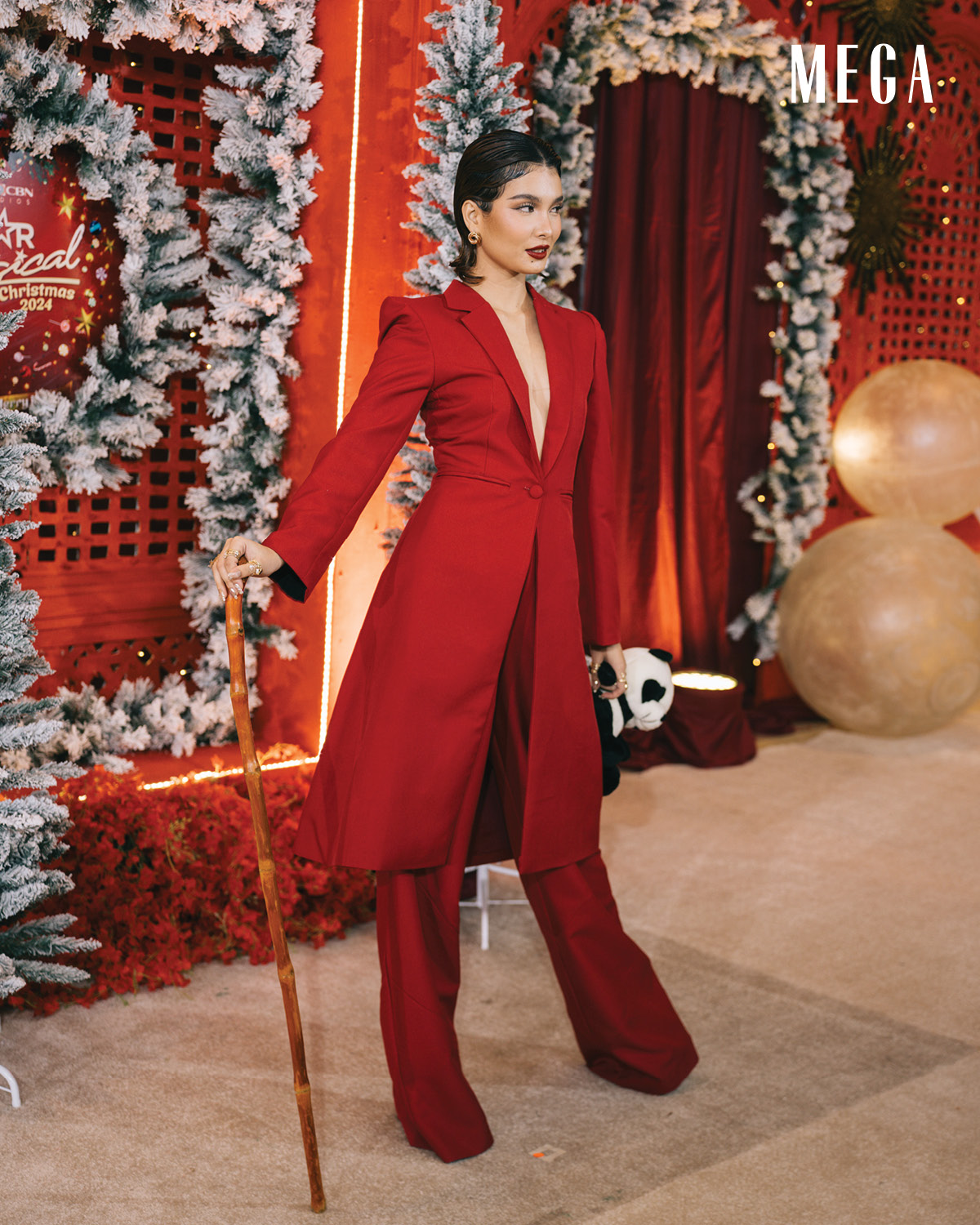 Embodying a girl boss, stylist Drew Lacia opted for a wooden cane for an added element of sophistication Anji Salvacion