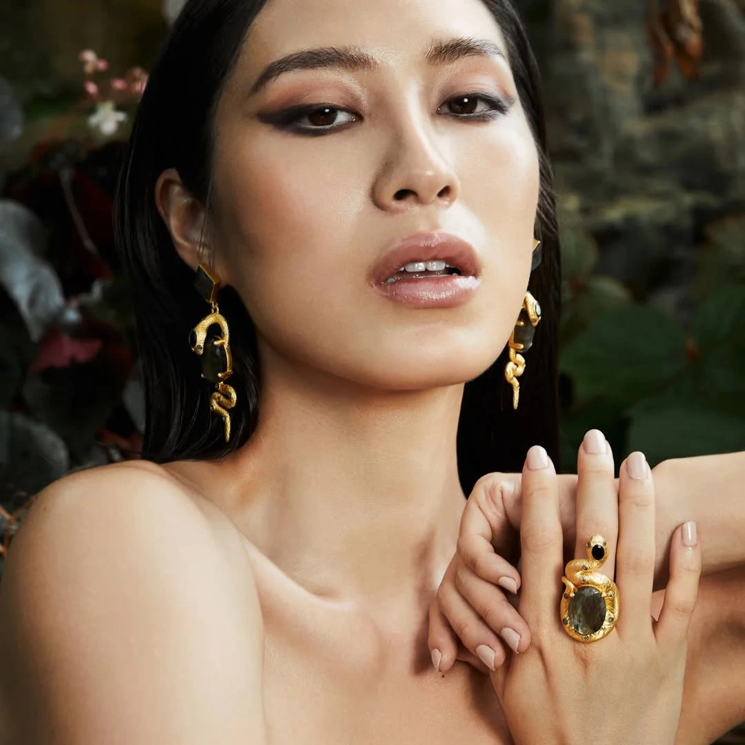 Her collections consistently draw from the natural world, with organic forms like flowers, leaves, coral textures, and palm silhouettes