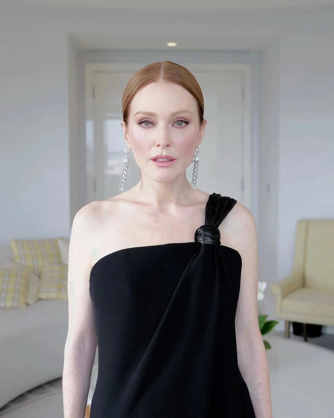 THE CLASSIC BLACK DRESS FEATURED A KNOTTED TASSELL