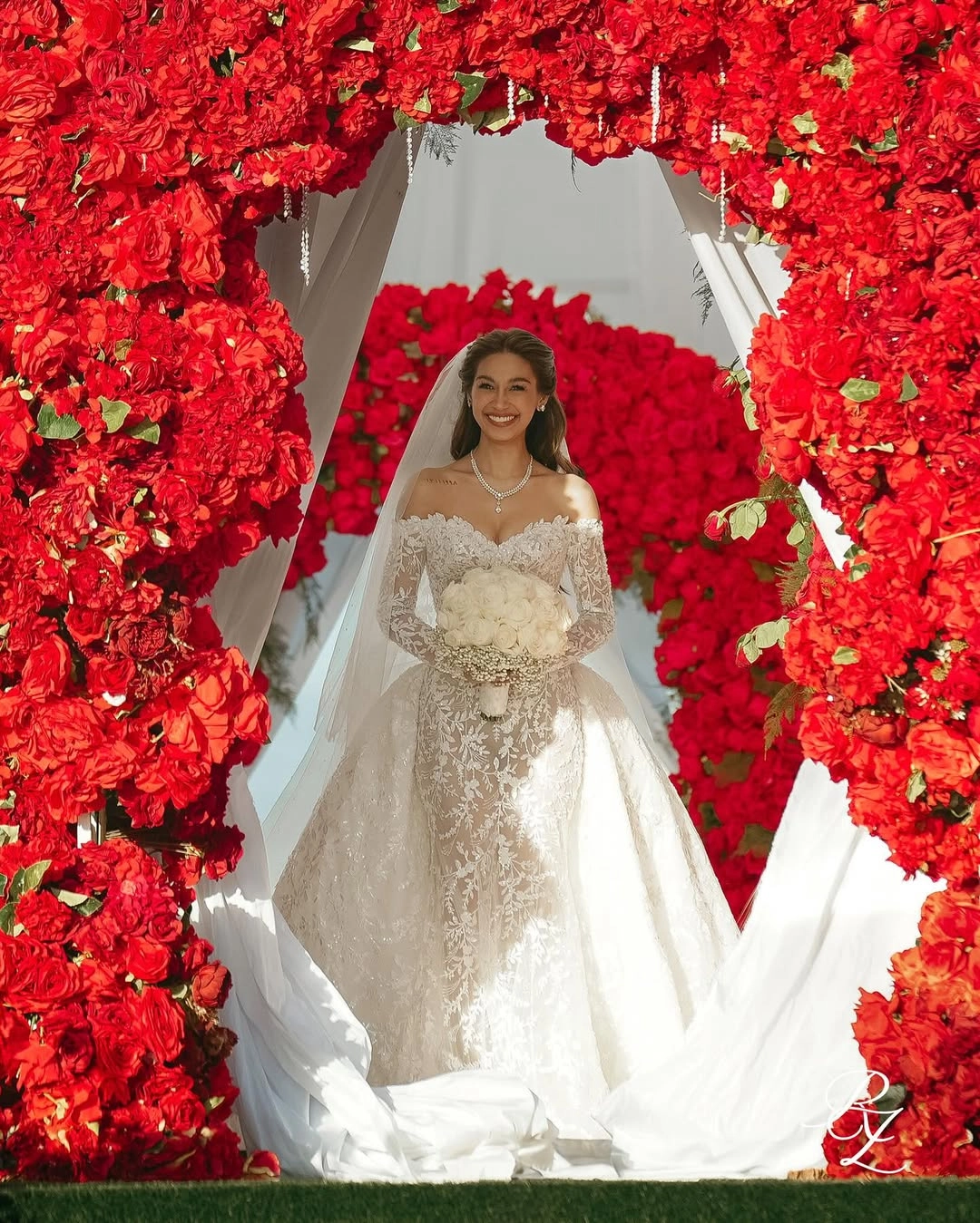 Zeinab Harake walking down the aisle in a custom Michael Cinco gown 