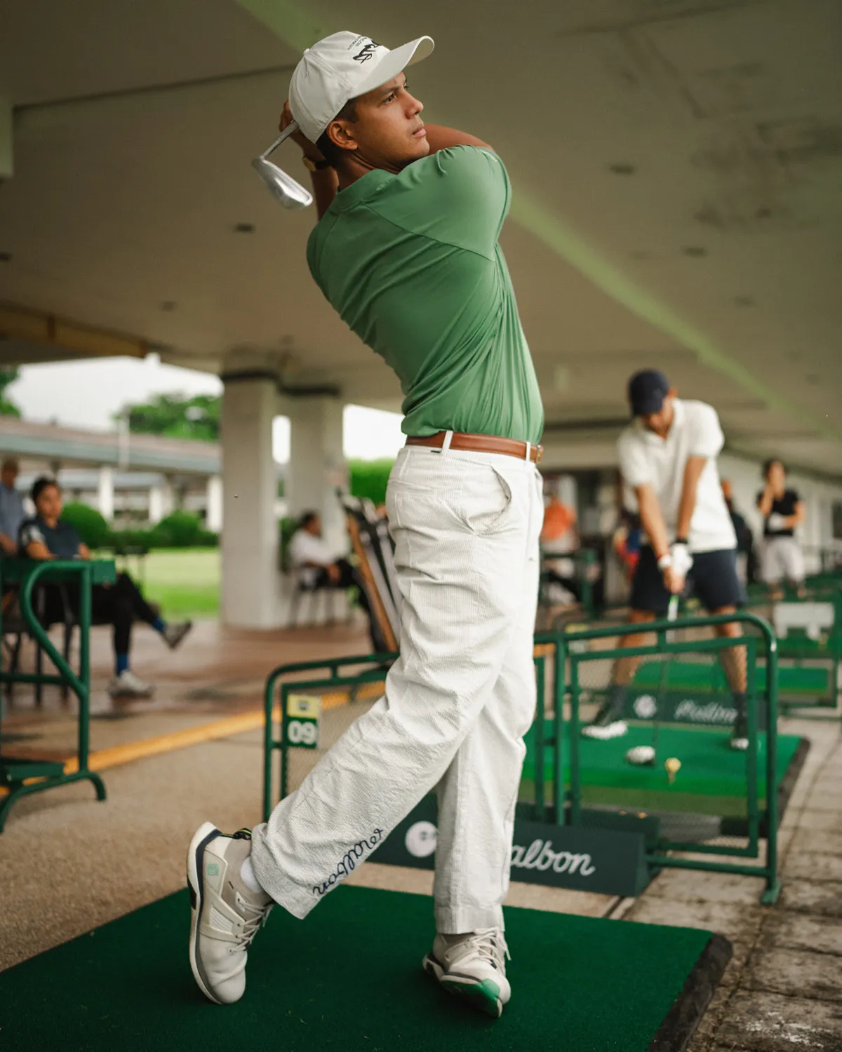 A man swinging at a shooting range in the club