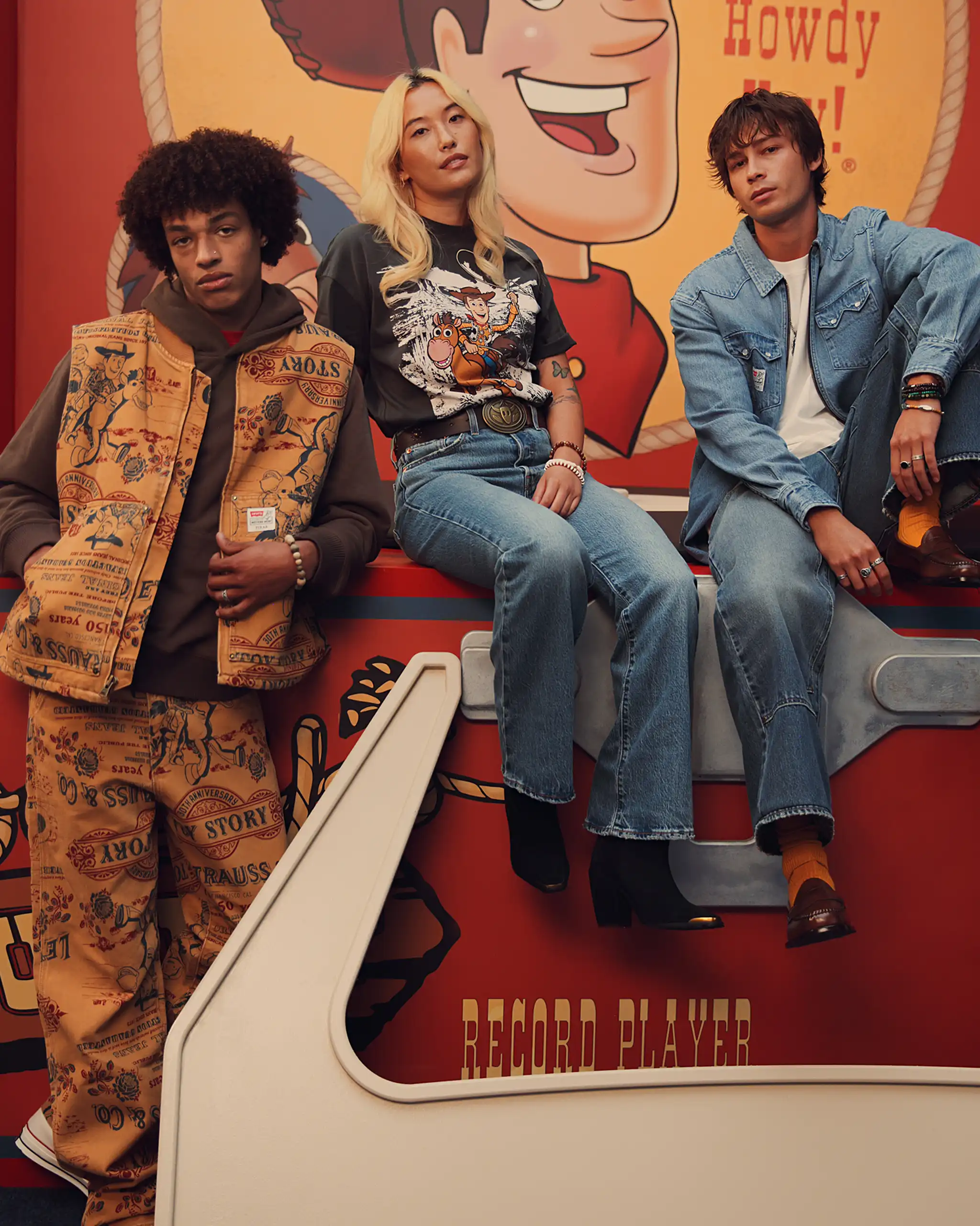 Three models styled in pieces from Levi's x Toy Story 30th Anniversary collection