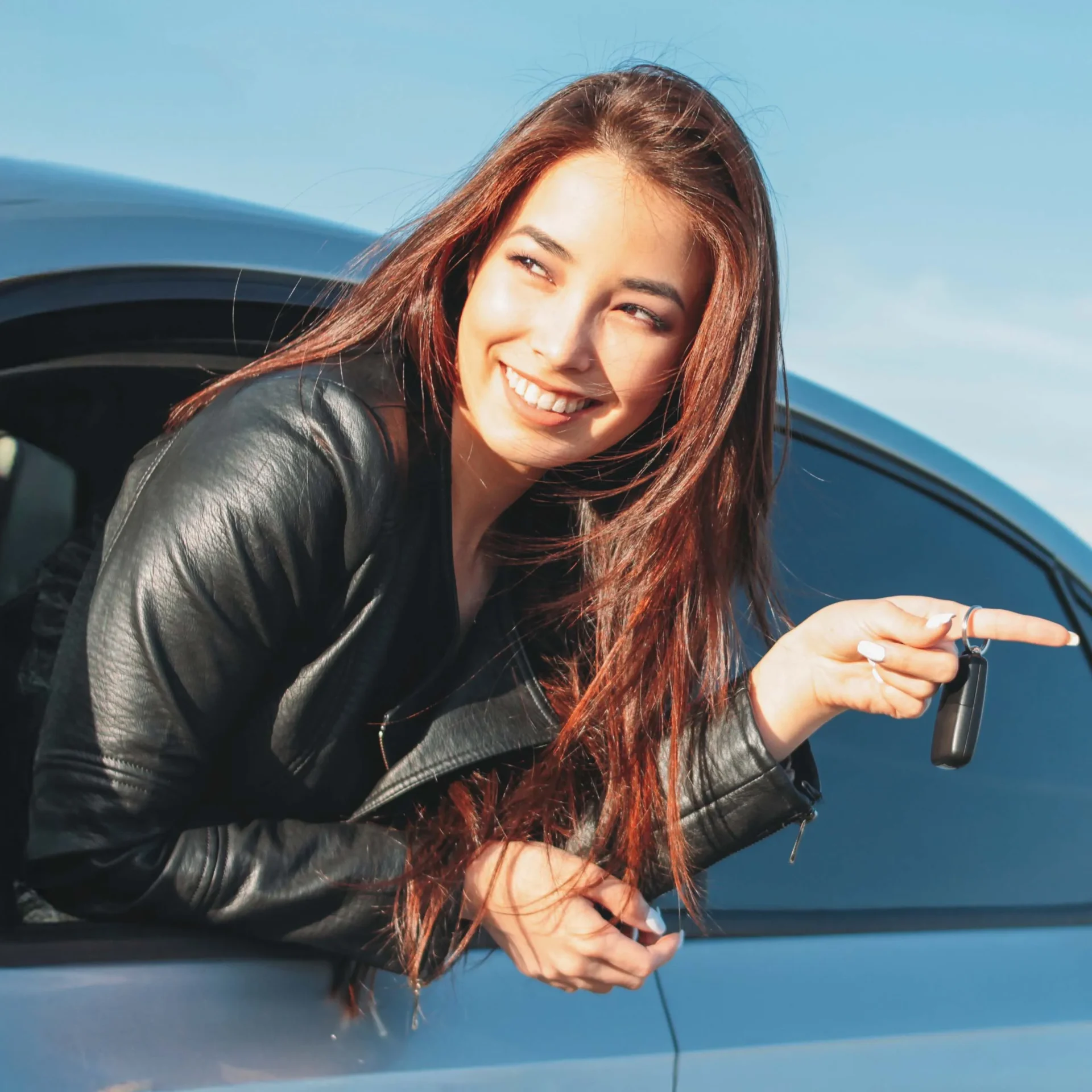 Out her car window, this girl rides to her next destination with Nissan