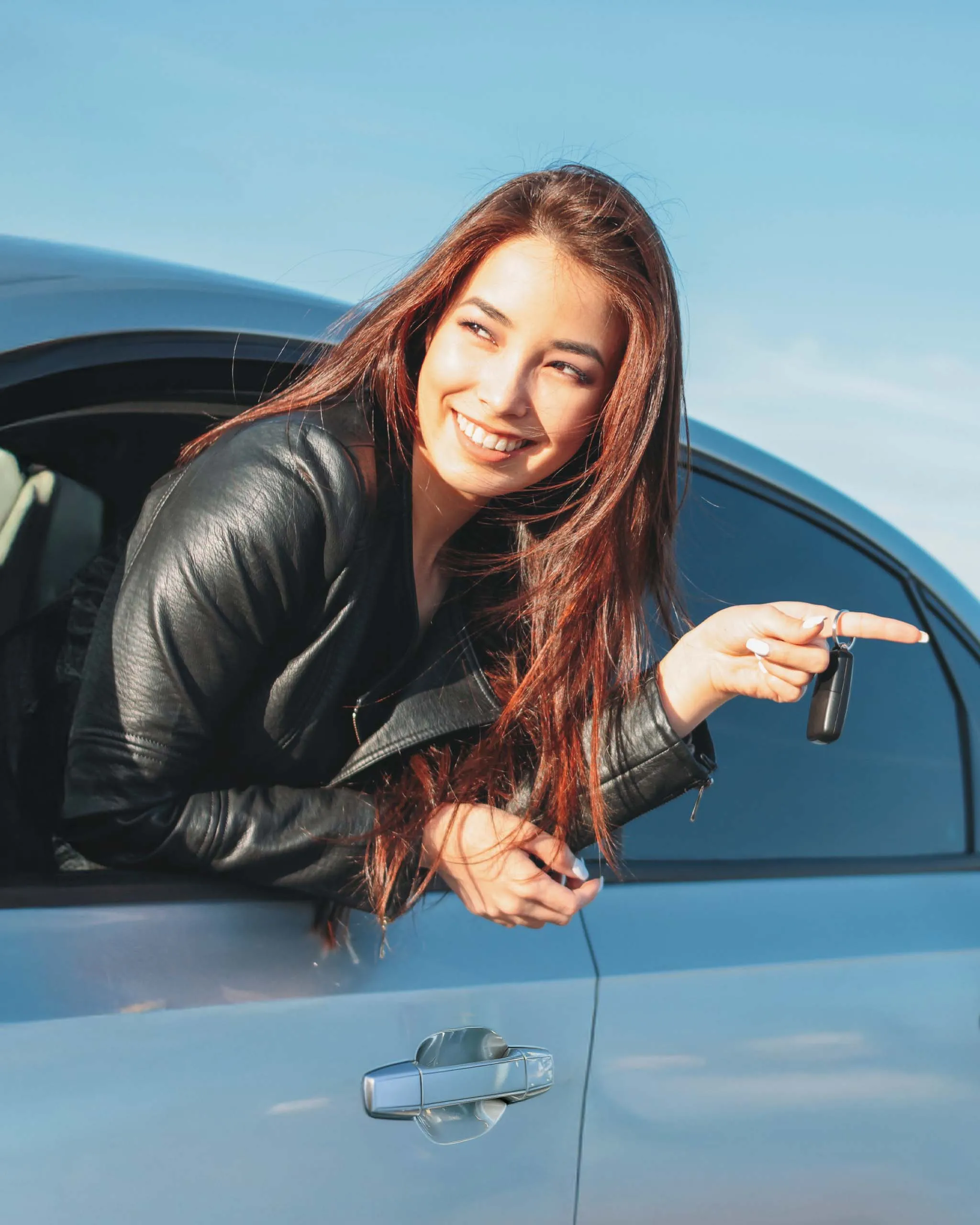 Out her car window, this girl rides to her next destination with Nissan