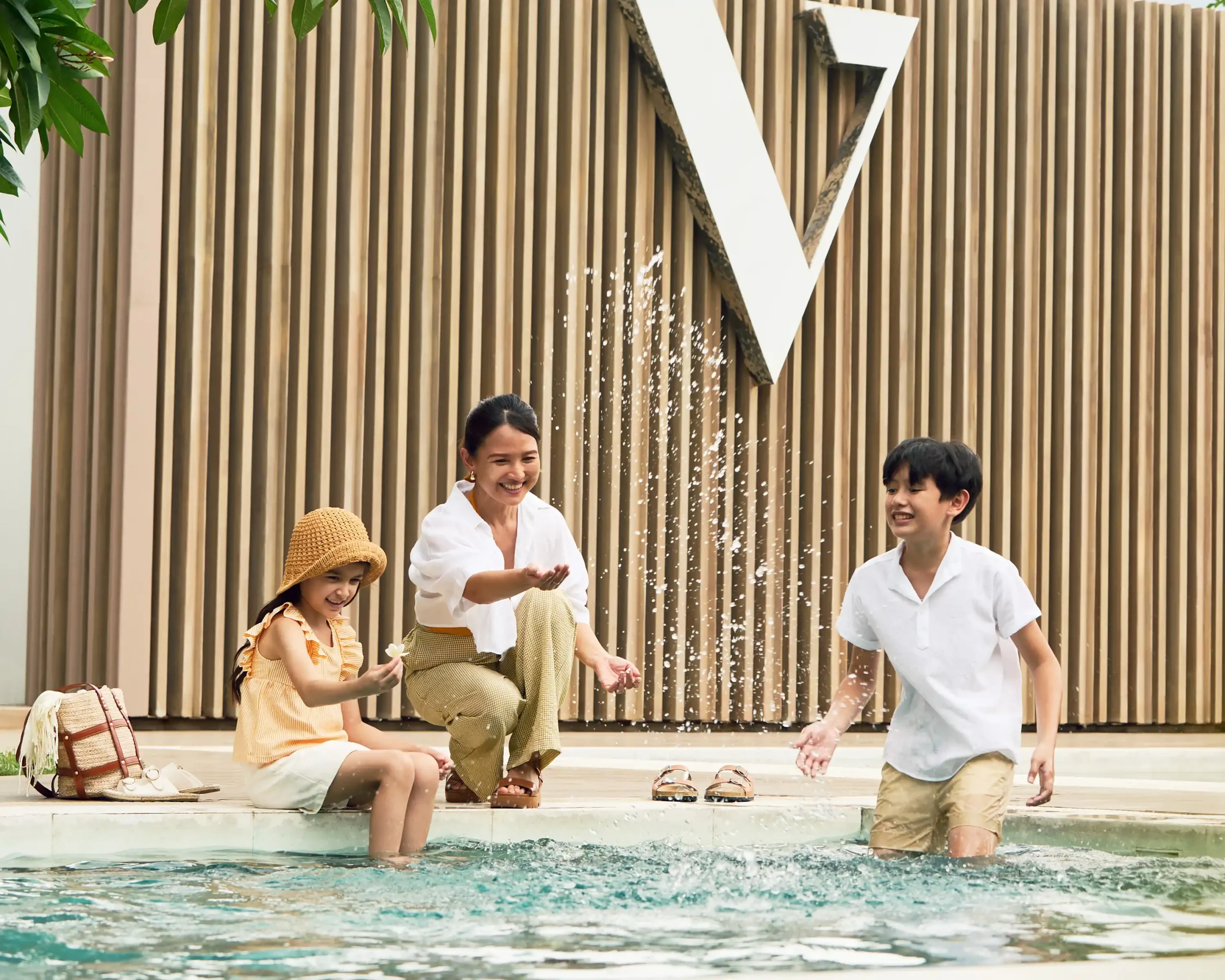 A woman and her family in the pool