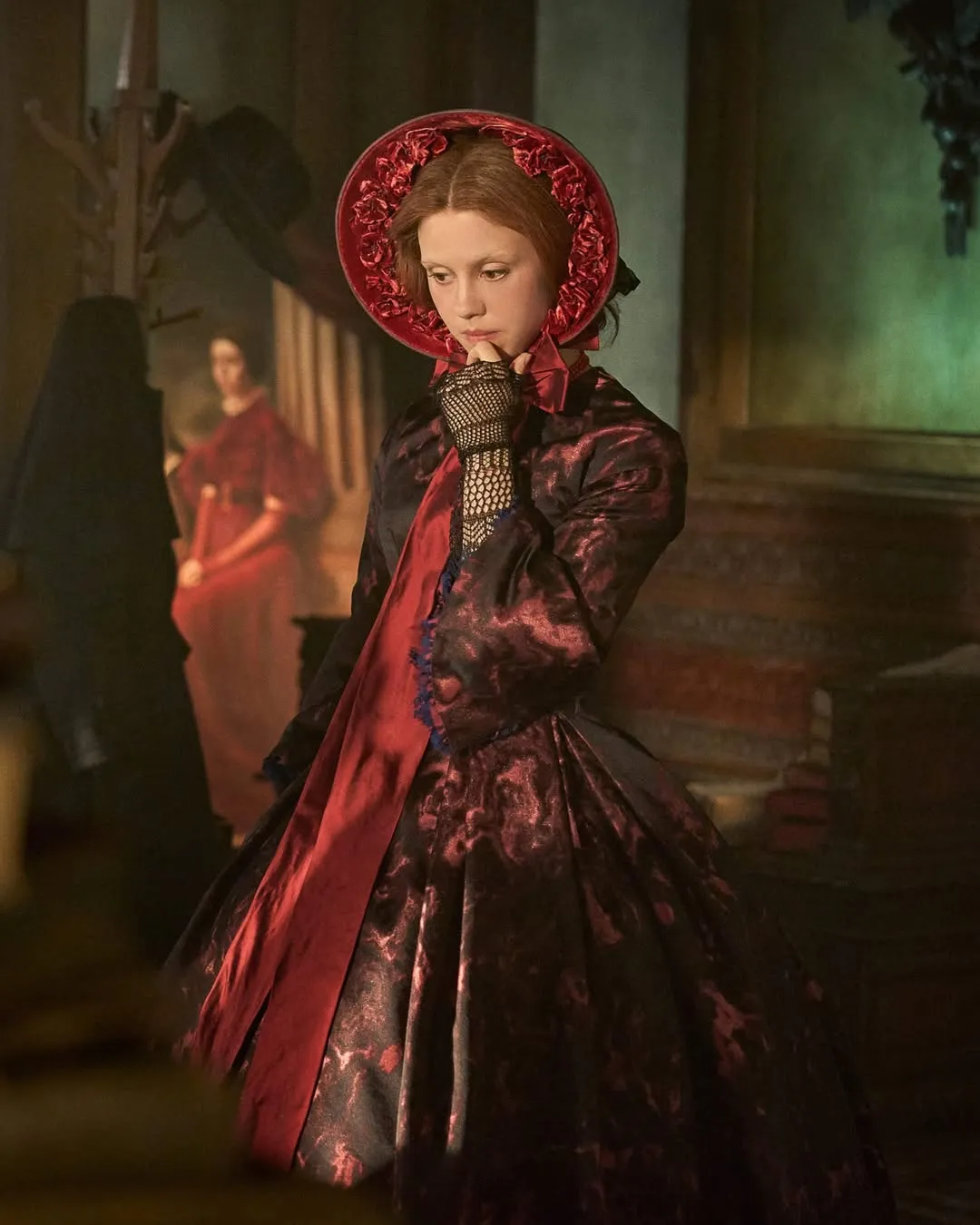 A HALO-LIKE BONNET NODS TO ELIZABETH'S RELIGIOUS CORE
