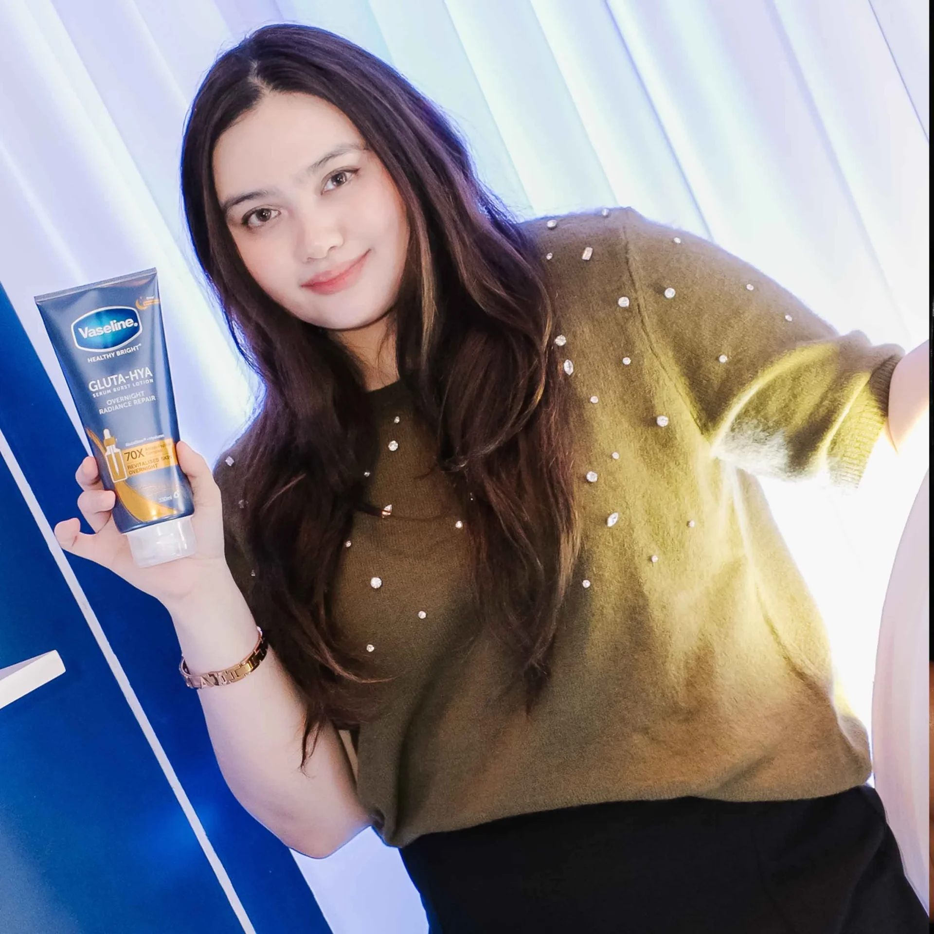 A girl and her Serum Burst Lotion.