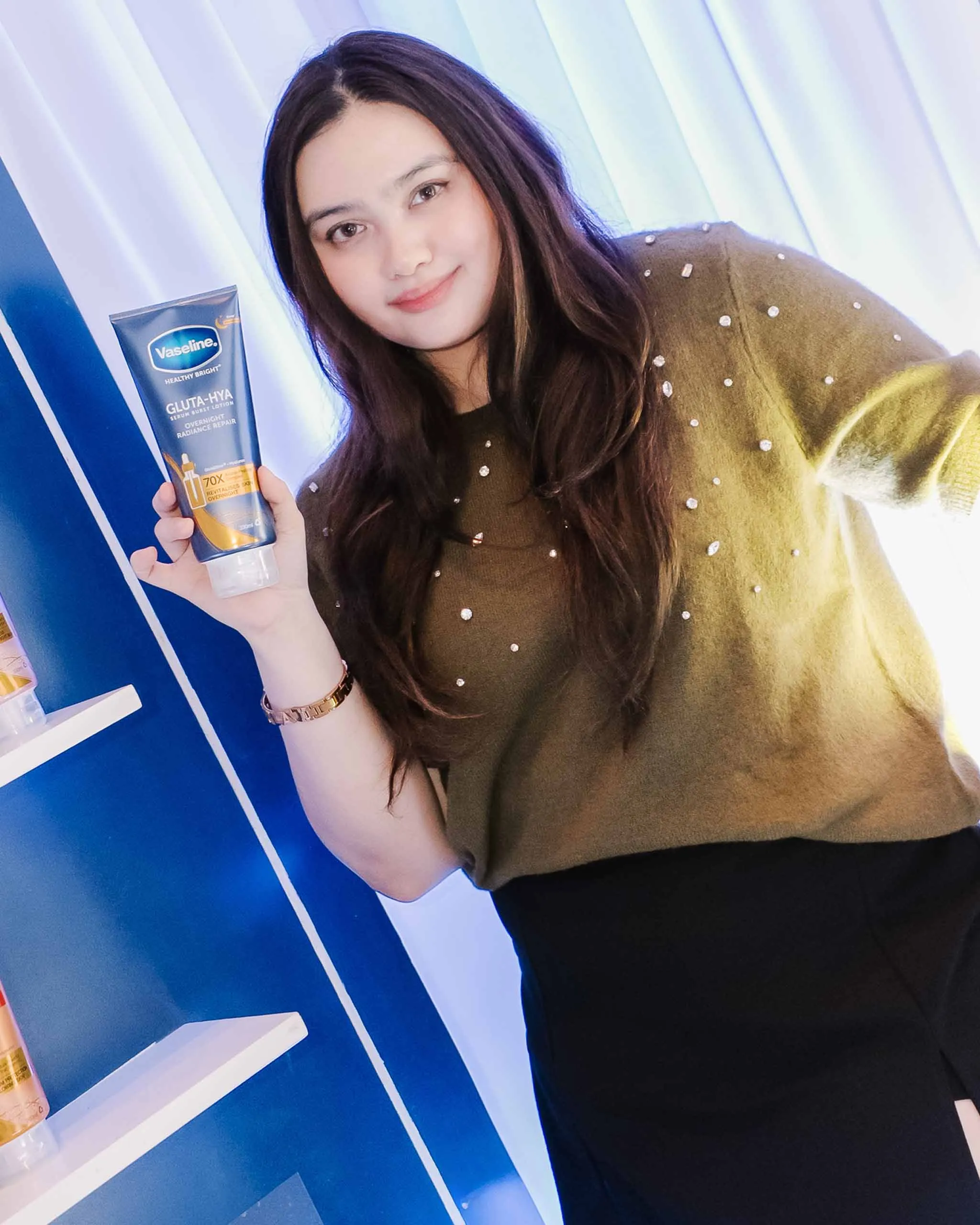 A girl and her Serum Burst Lotion.
