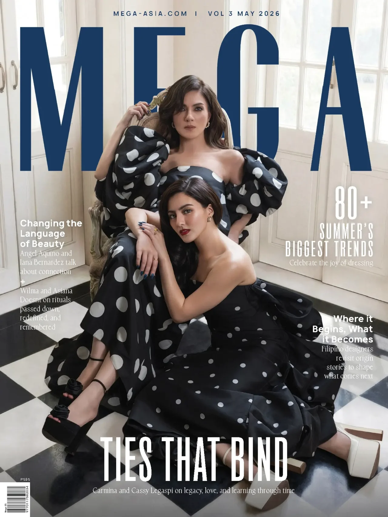 Magazine cover: two models in black-and-white polka-dot gowns pose on a checkered floor with oversized navy MEGA letters in the background.