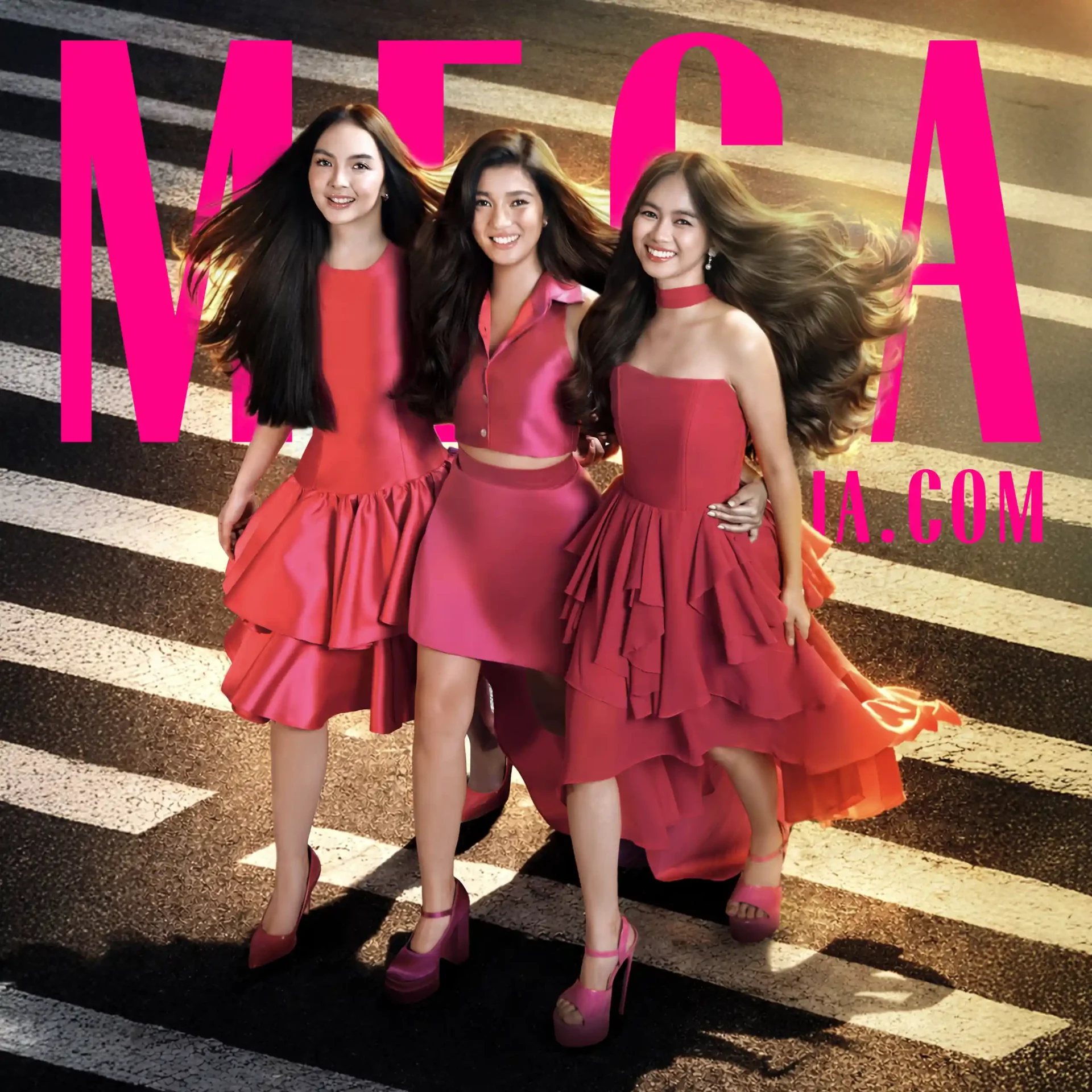 Three smiling women in pink dresses posing together on a striped crosswalk background. Pro fashion photo.