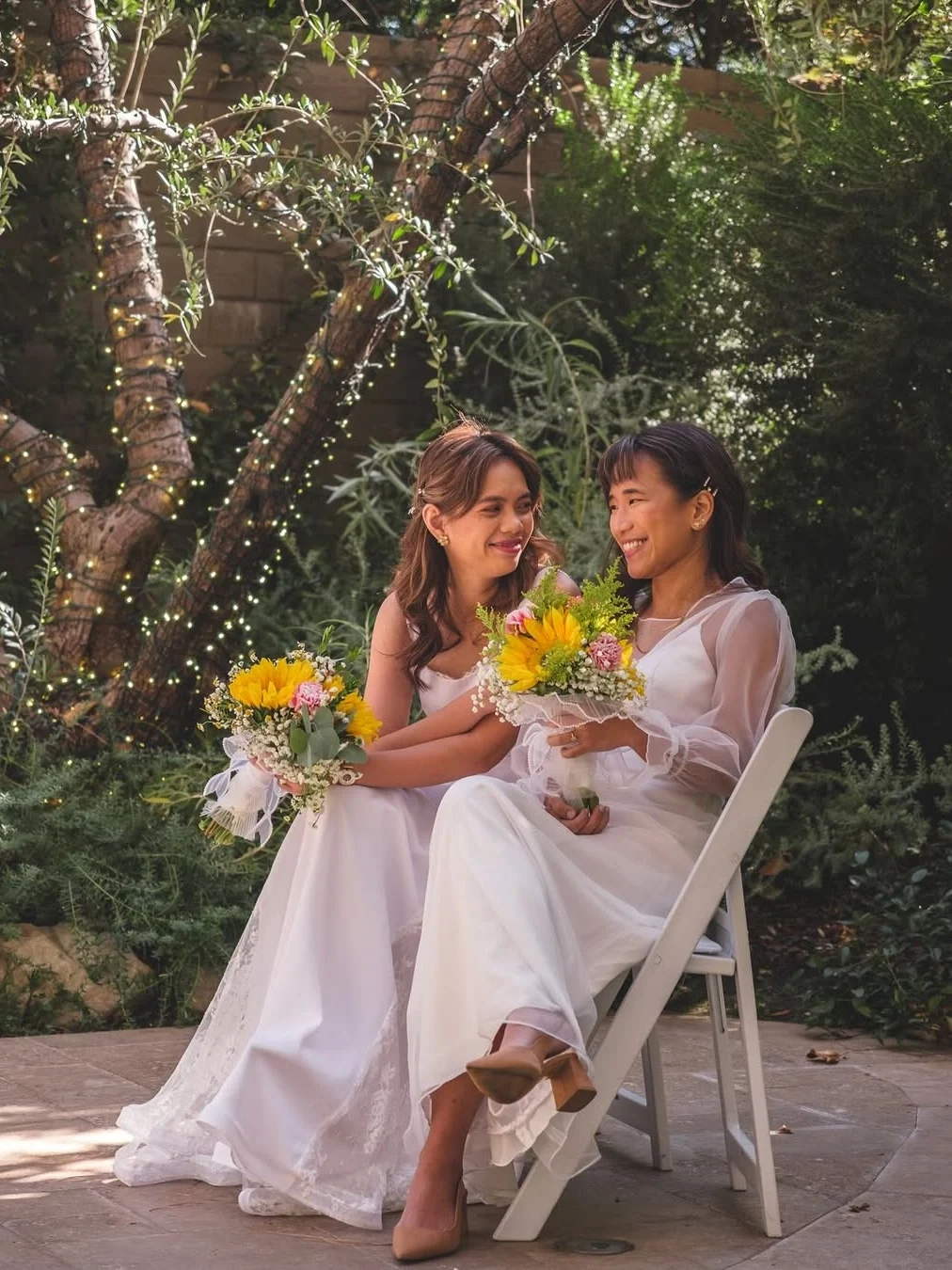 Ben&Ben’s Pat Lasaten in a mesh long-sleeve layer over a V-neck gown