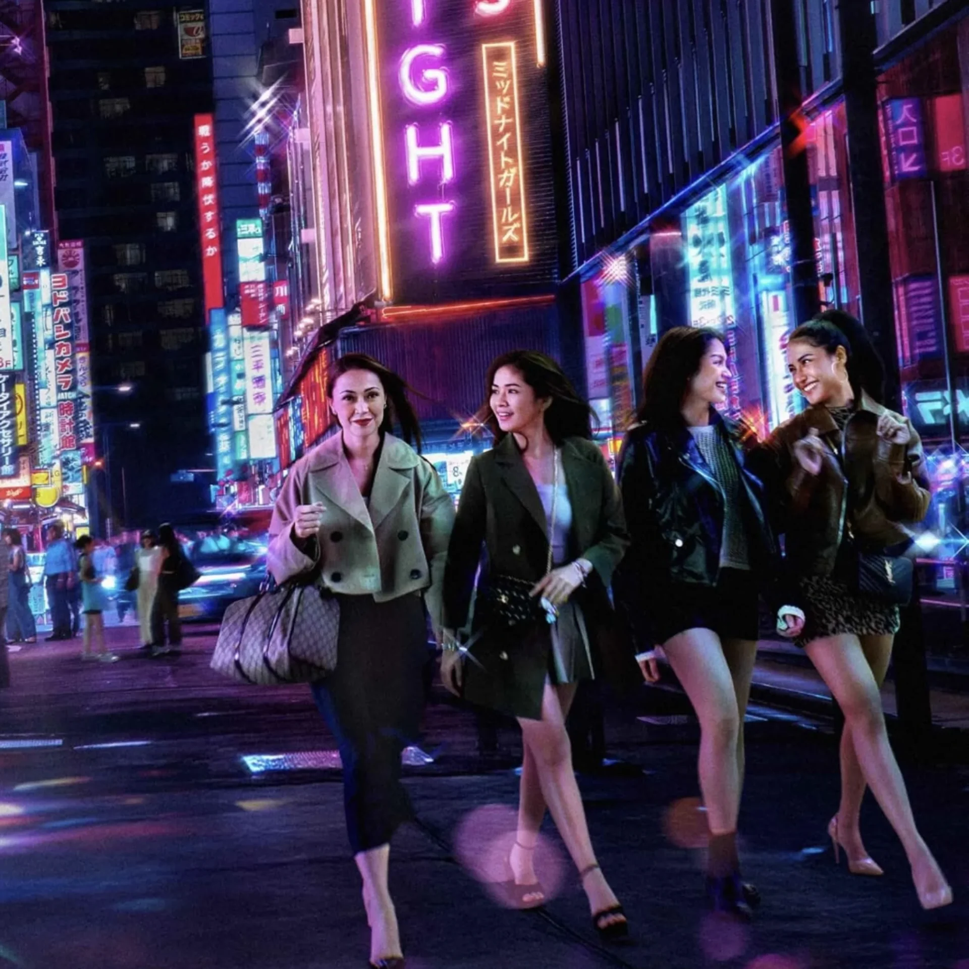 Group of fashionable women walking on a neon-lit city street at night with bright signs overhead.