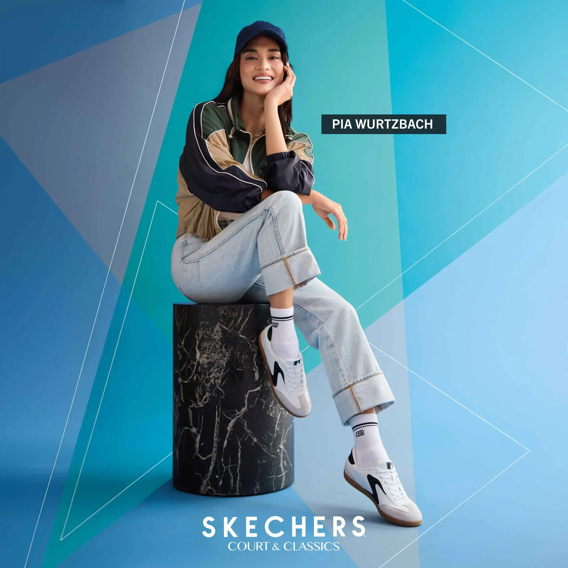 Model seated on a black marble pedestal against a blue geometric backdrop; Skechers branding visible at bottom.