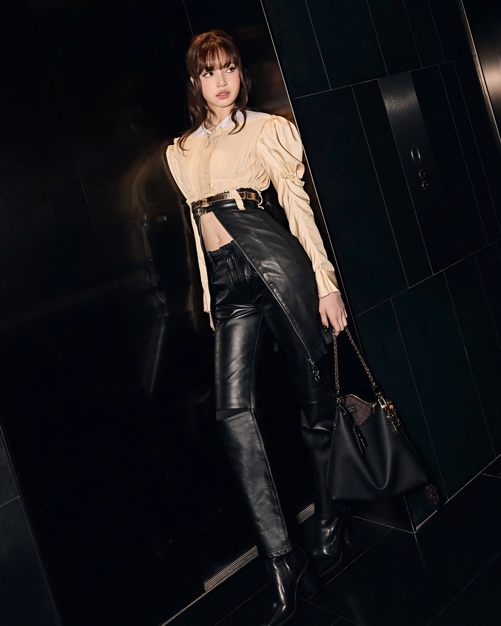 LISA wearing Louis Vuitton