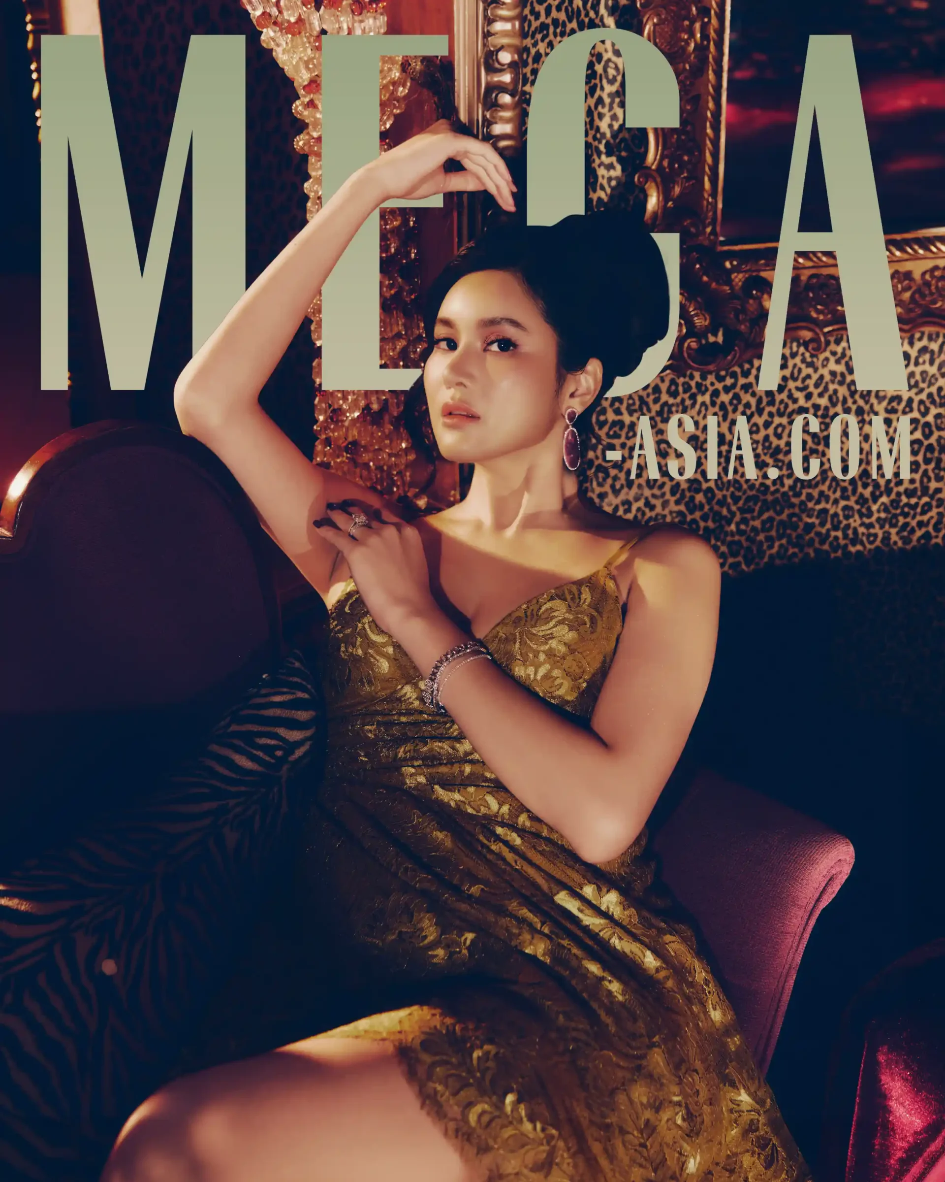 Elegant woman in a gold lace dress sits on a leopard-print backdrop with oversized text across the image (fashion/advertisement).