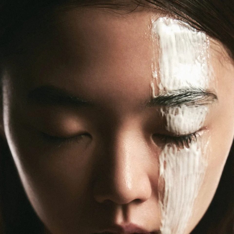 Close-up of a person’s eye with tears running down the cheek.
