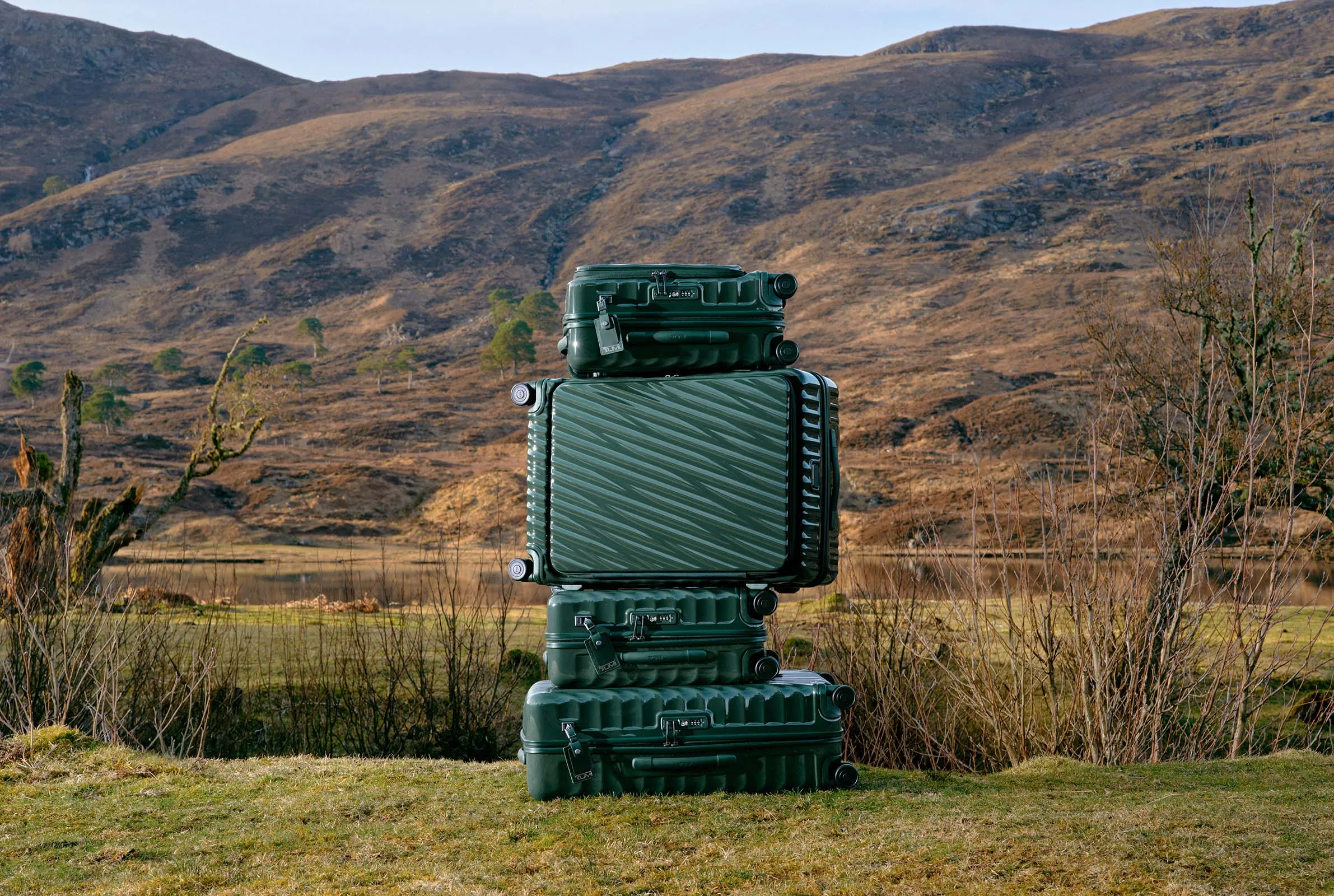 Highlight baggage laid on the alps in Deep Pine and green colorways