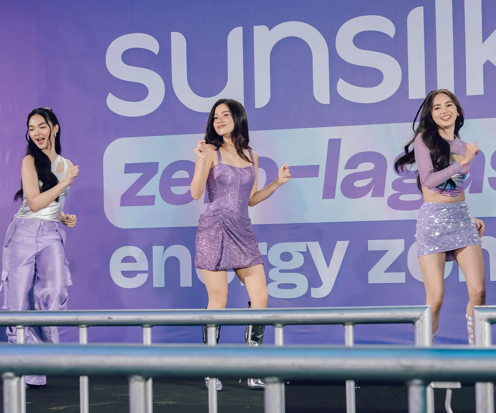 Hairkadas dancing on stage: Ashtine Olviga, Belle Mariano,  and Kai Montinola.