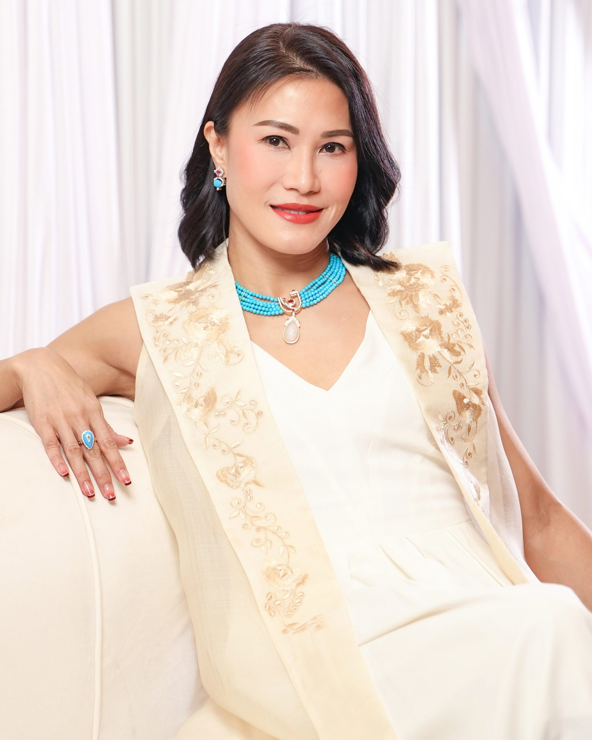Kristine Dee, the designer of The Woman Within and Alex Eala's sampaguita earrings
